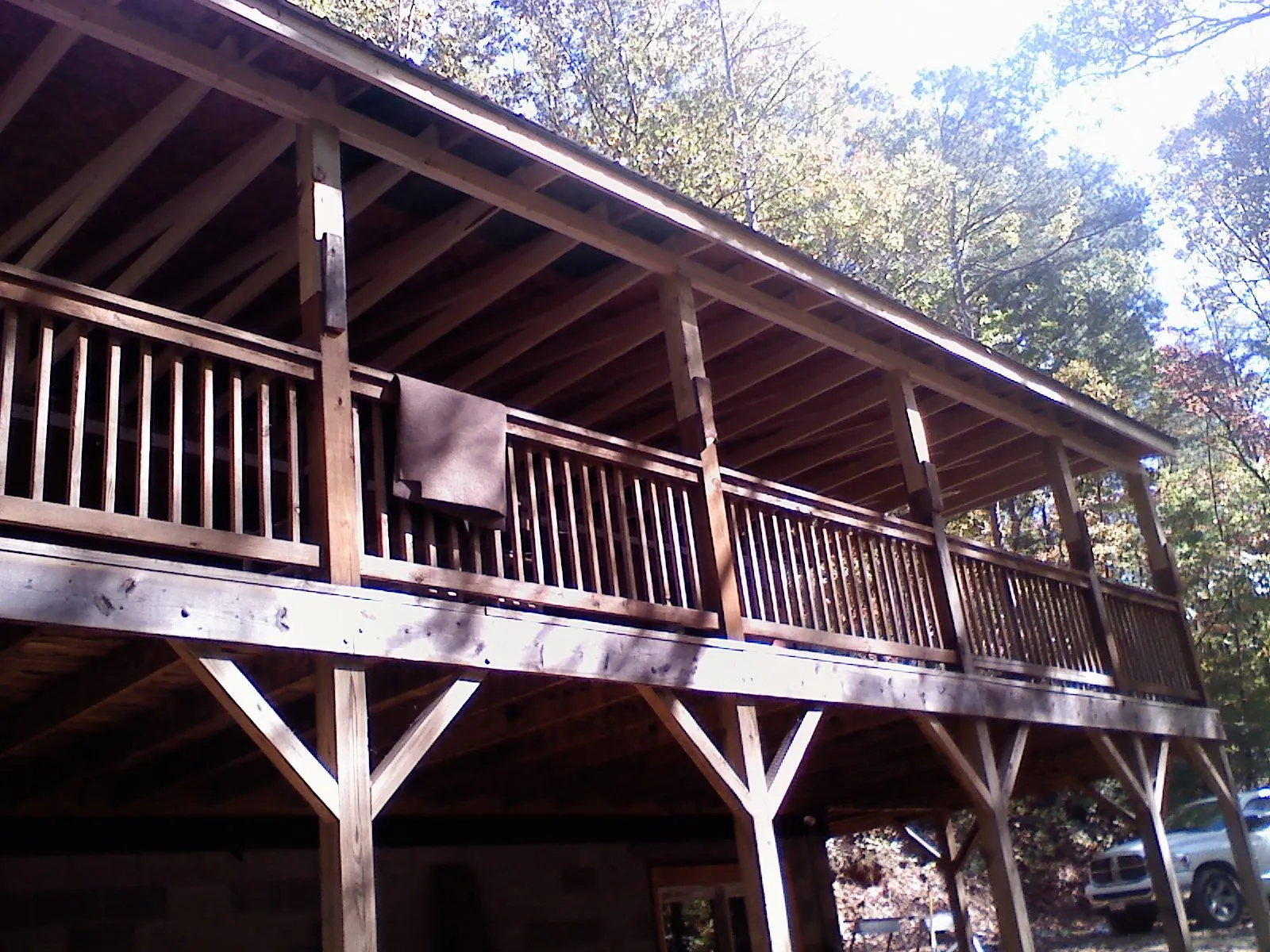 Timber framing under a new elevated porch and deck — Roof Leak Repair in Big Timber by Roofing Brothers